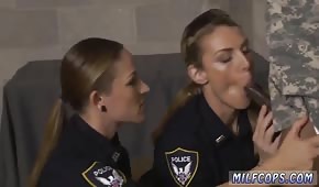 Cute policewomen are pulling a black cock