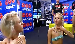 Naughty blondes kneel and pull cocks in the clubhouse